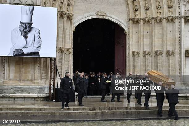 Pallbearers carry the coffin French chef Paul Bocuse at the end of the funeral ceremony held at the Saint-Jean Cathedral in Lyon on January 26, 2018....