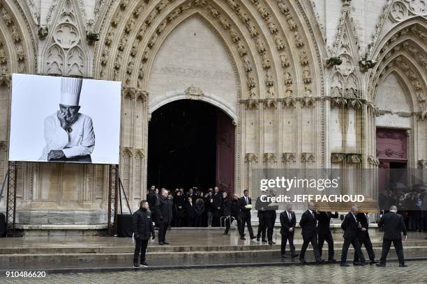 Pallbearers carry the coffin French chef Paul Bocuse at the end of the funeral ceremony held at the Saint-Jean Cathedral in Lyon on January 26, 2018....