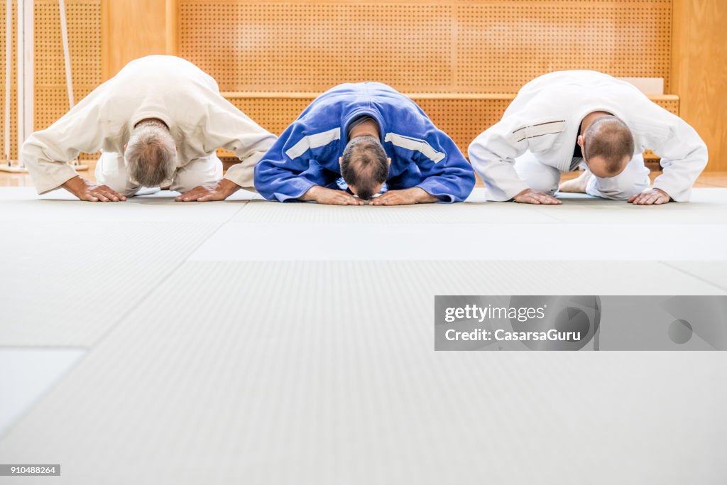 Three People in Kimono Bowing Down