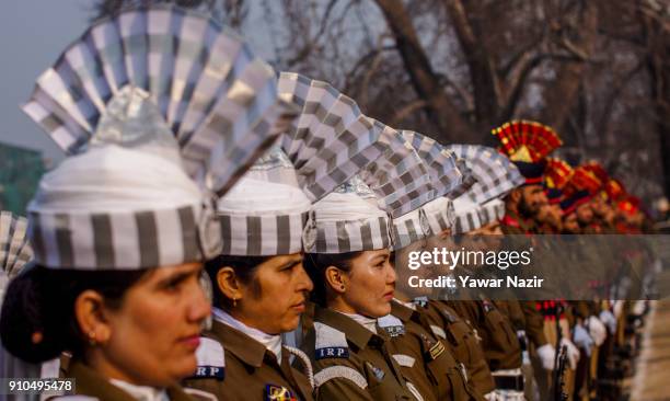 Contingent of Indian police stand in formation at the Sher- i- Kashmir stadium, where the authorities held the main function during India's Republic...