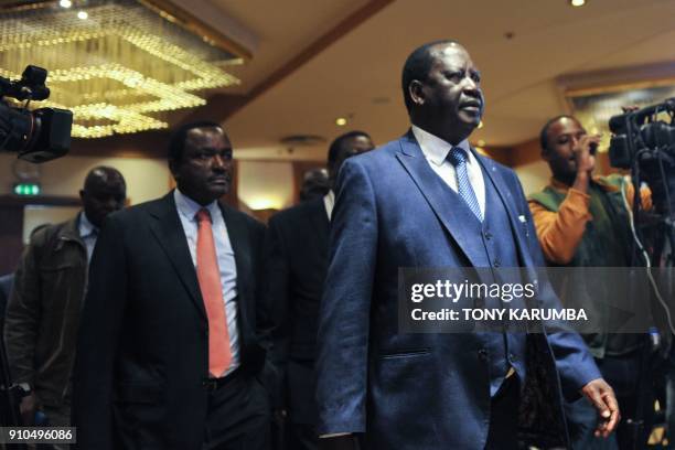 Raila Odinga, Kenya's opposition coalition, National Super Alliance leader arrives at a press conference followed by coalition co-proncipals, Kalonzo...