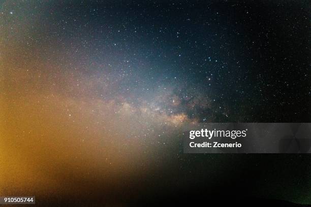 the milky way lies across dark sky in a space universe near pattaya, thailand - moon and stars stock pictures, royalty-free photos & images