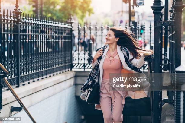 businesswoman in a hurry - london underground train stock pictures, royalty-free photos & images