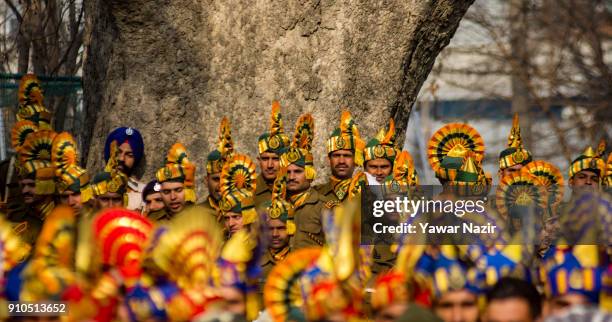 Indian paramilitary troopers look towards Kashmiri students performing before the Ministers and bureaucrats at the Sher- i- Kashmir stadium, where...