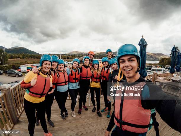 wetsuit selfie - paddleboarding team stock pictures, royalty-free photos & images