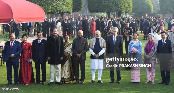 Indian Prime Minister Narendra Modi , Indian Vice President Venkaiah Naidu and Indian President Ram Nath Kovind pose with Prime Minister of Laos...