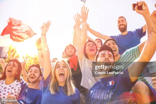 french supporters at the football league supporting their national team - france supporter stock pictures, royalty-free photos & images