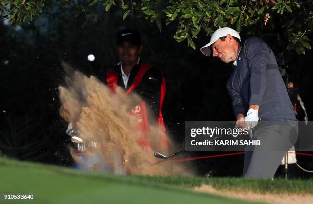 Rory McIlroy of Northern Ireland plays during round one of the Abu Dhabi HSBC Golf Championship at Abu Dhabi Golf Club on January 18, 2018. / AFP...