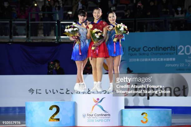 Mai Mihara , Kaori Sakamoto and Satoko Miyahara of Japan pose with on the podium during day three of the Four Continents Figure Skating Championships...