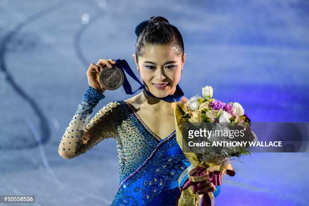 Bronze medallist Satoko Miyahara of Japan poses after the medal ceremony for the ladies free skating program at the ISU Four Continents figure...