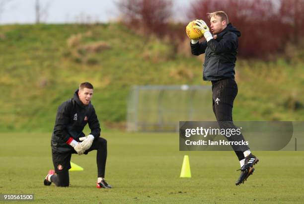 Keeper Jason Steele goes through his warm up watched by Robin Ruiter during a Sunderland AFC training session at The Academy of Light on January 26,...