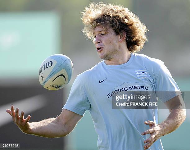 Francois Steyn of South-Africa grabs the ball during a training session of the French Top 14 rugby union club Racing-Metro on September 23, 2009 in...