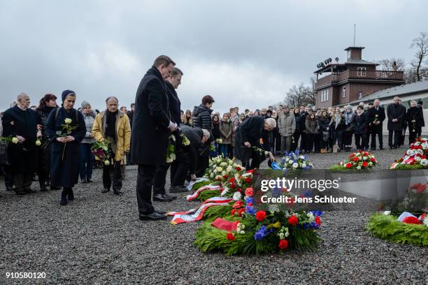 Holocaust survivors and relatives set flowers down at the Buchenwald concentration camp memorial to commemorate victims of the Holocaust on January...