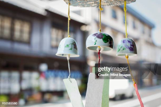 close up of porcelain bells in a japanese workshop. - midden oosterse cultuur stockfoto's en -beelden