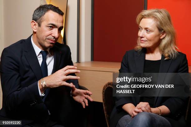 French Ligue de football professionnel's president Nathalie Boy de La Tour , listens at French former football player Youri Djorkaeff, named...