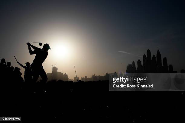 Rory McIlroy of Northern Ireland hits his tee shot on the 8th hole during round two of the Omega Dubai Desert Classic at Emirates Golf Club on...