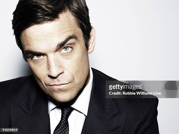 Singer Robbie Williams poses for a portrait shoot by photographer Julian Broad in Wiltshire on June 11, 2009.