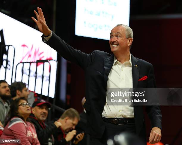 New Jersey Gov. Phil Murphy waves as he attends a game between the Nebraska Cornhuskers and Rutgers Scarlet Knights at Rutgers Athletic Center on...