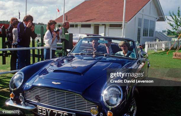 Prince Charles drives Diana Princess of Wales, in his Aston Martin car, from a Guards Club polo match on Smiths Lawn, Windsor, Berkshire on June 1,...