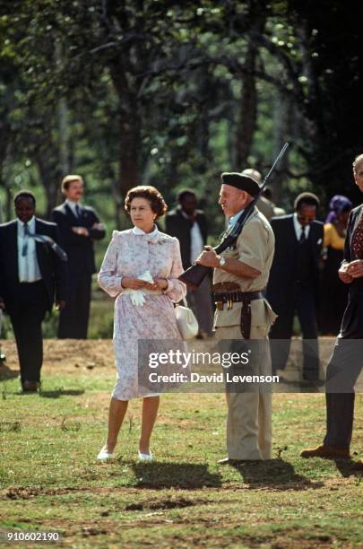 Queen Elizabeth II and Prince Philip are shown around the 'Treetops' hotel by Richard Prickett on November 13, 1983 near Sagana in Kenya. It was...