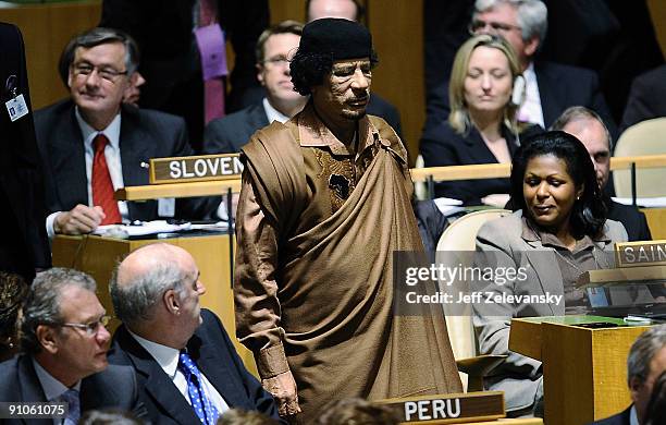 Libyan leader Colonel Muammar Al-Qadhafi walks through the chamber at the 64th General Assembly at United Nations Headquarters on September 23, 2009...