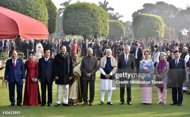 Indian Prime Minister Narendra Modi , Indian Vice President Venkaiah Naidu and Indian President Ram Nath Kovind pose with Prime Minister of Laos...