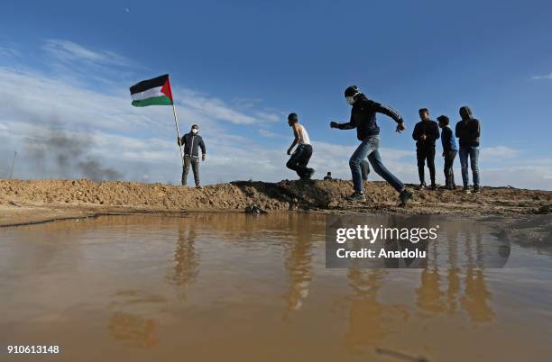 Protesters hold Palestinian flags during a protest against U.S. President Donald Trumps announcement to recognize Jerusalem as the capital of Israel,...