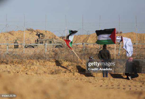 Protesters hold Palestinian flags during a protest against U.S. President Donald Trumps announcement to recognize Jerusalem as the capital of Israel,...