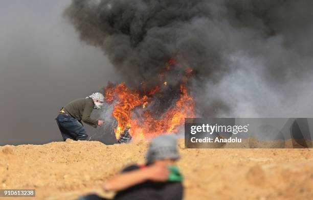 Palestinian protesters burn tyres during a protest against U.S. President Donald Trumps announcement to recognize Jerusalem as the capital of Israel,...