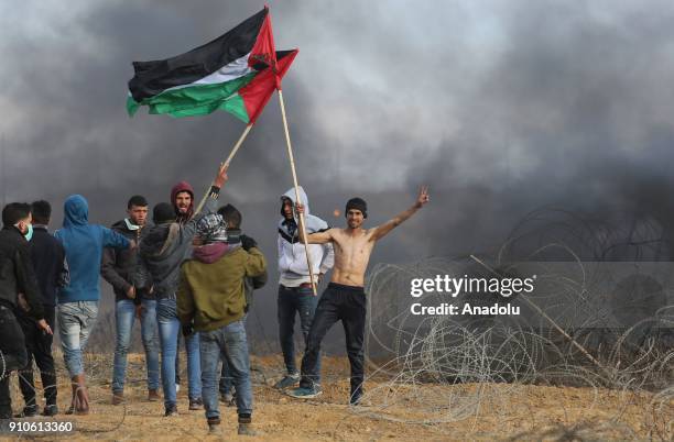 Protesters hold Palestinian flags during a protest against U.S. President Donald Trumps announcement to recognize Jerusalem as the capital of Israel,...