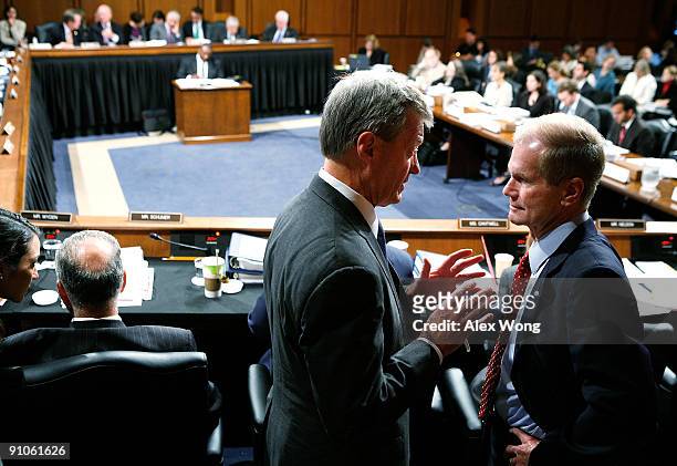 Committee Chairman Sen. Max Baucus talks to Sen. Bill Nelson during a mark up hearing before the U.S. Senate Finance Committee on Capitol Hill...