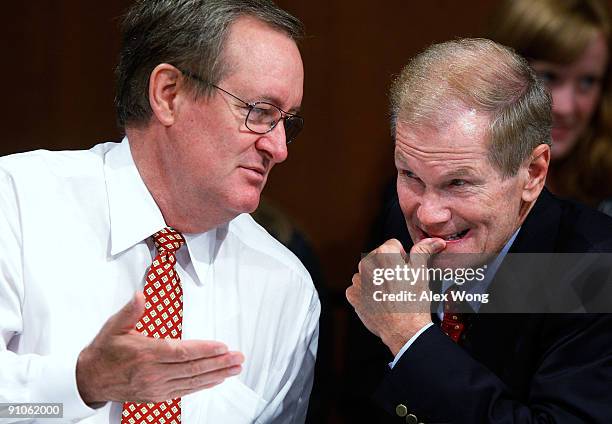 Sen. Bill Nelson talks to Sen. Mike Crapo during a mark up hearing before the Senate Finance Committee on Capitol Hill September 23, 2009 in...