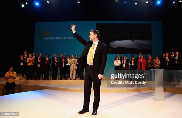 Leader of the Liberal Democrats, Nick Clegg, gestures to delegates as he is applauded after he made his leadership speech at the Bournemouth...