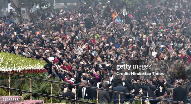 Spectators cheer on the arrival of President Ram Nath Kovind and Prime Minister Narendra Modi during the Republic Day Parade, at Rajpath, on January...