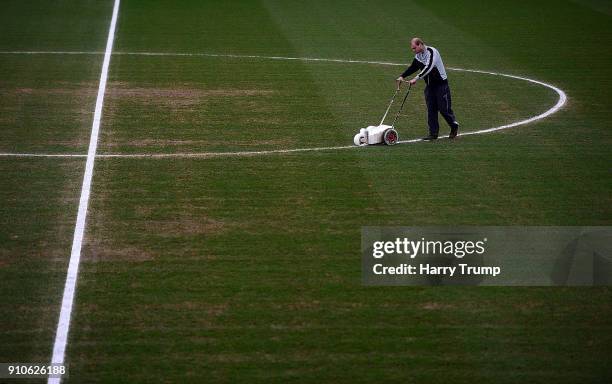 Groundsman paints the lines prior to kick off during The Emirates FA Cup Fourth Round match between Yeovil Town and Manchester United at Huish Park...