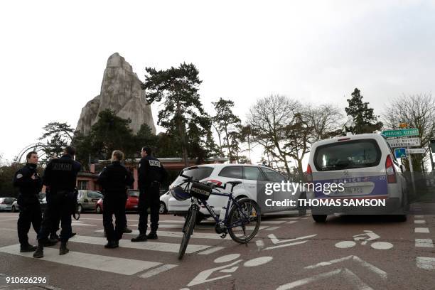 Police officers patrol outside of the Paris Zoological Park in the Bois de Vincennes, eastern Paris, on January 26 following the escape of nearly 50...