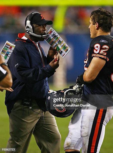 Head coach Lovie Smith of the Chicago Bears gives instructions to Hunter Hillenmeyer during a game against the Pittsburgh Steelers on September 20,...