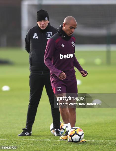 New Signing Joao Mario is watched by manager David Moyes during the West Ham United Training session at Rush Green on January 26, 2018 in Romford,...