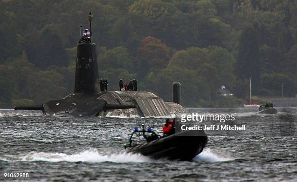 Trident submarine makes it's way out from Faslane Naval base on September 23, 2009 in Faslane, Scotland. British prime minister Gordon Brown, will...