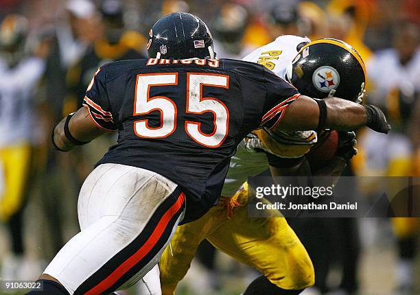 Lance Briggs of the Chicago Bears tackles Willie Parker of the Pittsburgh Steelers on September 20, 2009 at Soldier Field in Chicago, Illinois. The...