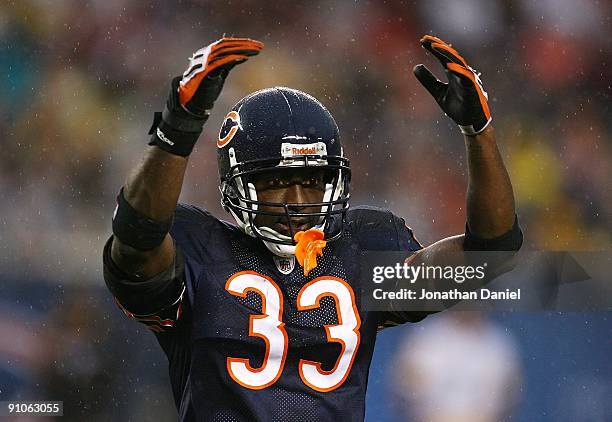 Charles Tillman of the Chicago Bears encourages fans to cheer during a game against the Pittsburgh Steelers on September 20, 2009 at Soldier Field in...