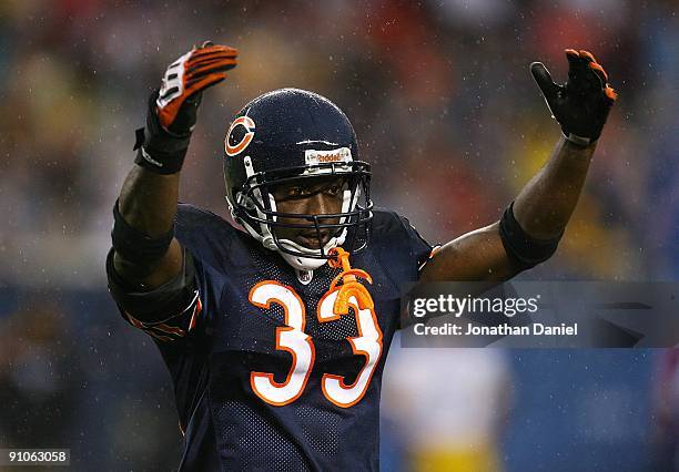 Charles Tillman of the Chicago Bears encourages fans to cheer during a game against the Pittsburgh Steelers on September 20, 2009 at Soldier Field in...