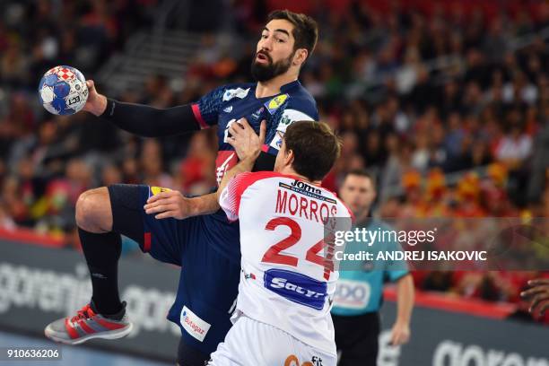 France's Nikola Karabatic vies with Spain's Viran Morros de Argila during the semi-final match of the Men's 2018 EHF European Handball Championship...