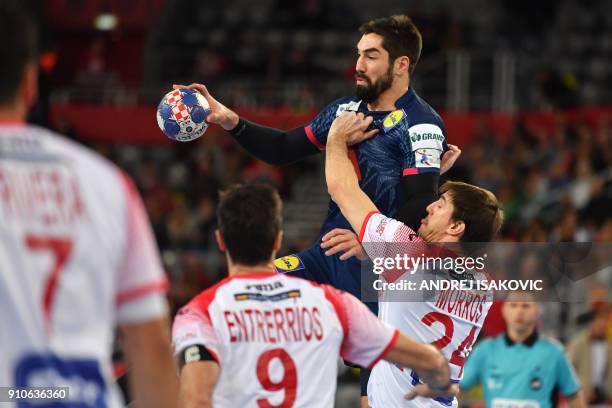 France's Nikola Karabatic vies with Spain's Viran Morros de Argila during the semi-final match of the Men's 2018 EHF European Handball Championship...