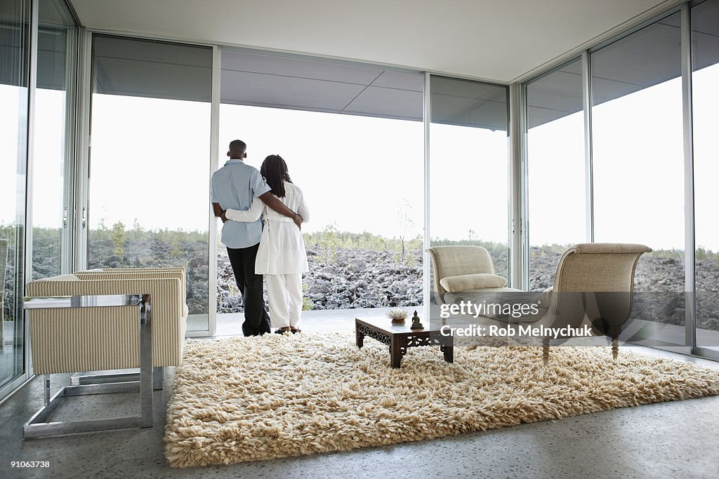 African American couple, looking out at rocks.