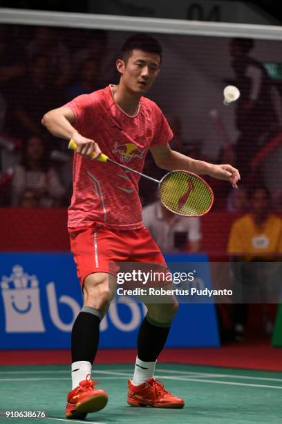Chen Long of China competes against Anthony Sinisuka Ginting of Indonesia during the Men's Singles Quarter Final match of the Daihatsu Indonesia...