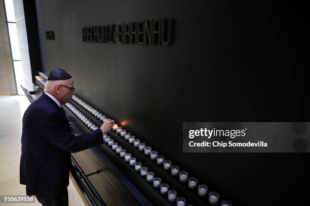 Holocaust Memorial Council Chairman Howard Lorber lights a candle to commemorate International Holocaust Remembrance Day during a ceremony at the...