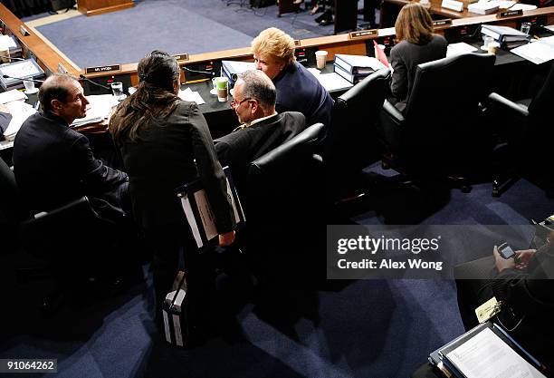 Sen. Ron Wyden , Sen Charles Schumer and Sen. Debbie Stabenow discuss during a mark up hearing before the Senate Finance Committee on Capitol Hill...