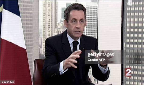 This Tv grab taken from French TV channel France 2 shows French president Nicolas Sarkozy answering to journalists Laurence Ferrari and David...