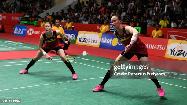 Kamilla Rytter Juhl and Christinna Pedersen of Denmark compete against Jongkolphan Kititharakul and Rawinda Prajongjai of Thailand during the Women's...